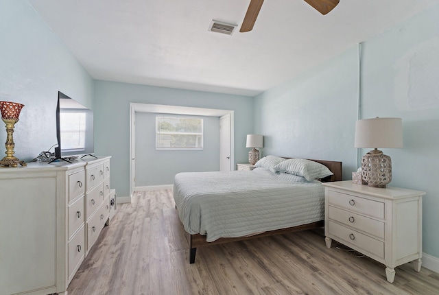 1157 NW 14th Ter, Stuart, FL 34994 - bedroom with light wood-type flooring and ceiling fan