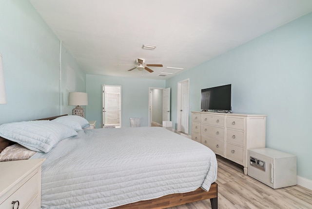 1157 NW 14th Ter, Stuart, FL 34994 - bedroom featuring light wood finished floors and ceiling fan