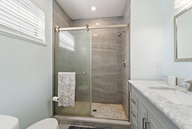 1157 NW 14th Ter, Stuart, FL 34994 - bathroom featuring vanity, a shower stall, and recessed lighting