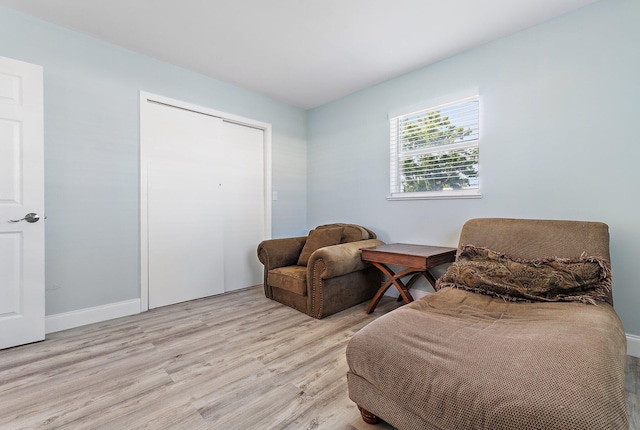 1157 NW 14th Ter, Stuart, FL 34994 - living area with light wood-style floors and baseboards