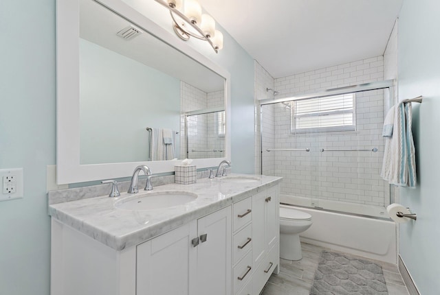 1157 NW 14th Ter, Stuart, FL 34994 - full bathroom featuring double vanity and combined bath / shower with glass door
