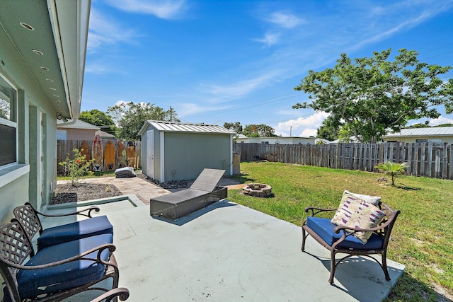 1157 NW 14th Ter, Stuart, FL 34994 - fenced backyard featuring an outdoor fire pit, a shed, and a patio