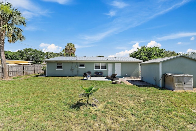 1157 NW 14th Ter, Stuart, FL 34994 - rear view of house with a patio area, a metal roof, and stucco siding