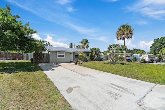 1157 NW 14th Ter, Stuart, FL 34994 - single story home featuring driveway and a metal roof