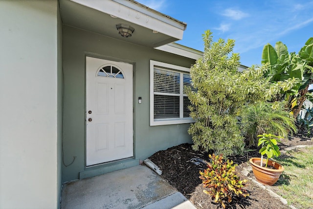 1157 NW 14th Ter, Stuart, FL 34994 - view of exterior entry with stucco siding