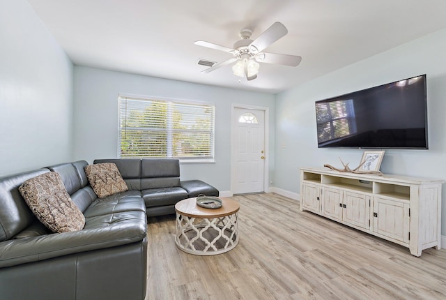 1157 NW 14th Ter, Stuart, FL 34994 - living room with light wood-style flooring and ceiling fan