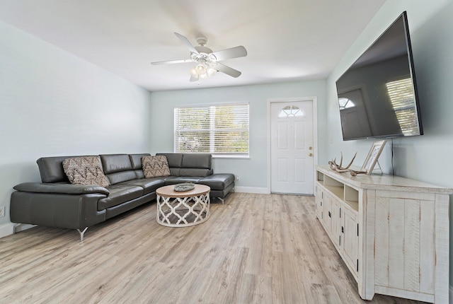 1157 NW 14th Ter, Stuart, FL 34994 - living room featuring light wood finished floors and ceiling fan