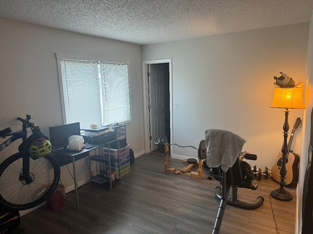 327 NE Surfside Ave, Port Saint Lucie, FL 34983 - office featuring wood finished floors and a textured ceiling