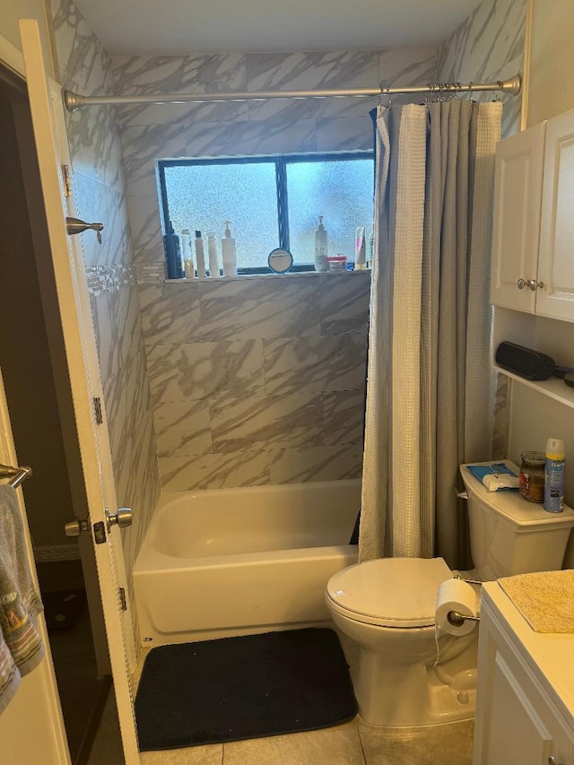 327 NE Surfside Ave, Port Saint Lucie, FL 34983 - full bath featuring vanity, shower / bathtub combination with curtain, and tile patterned floors