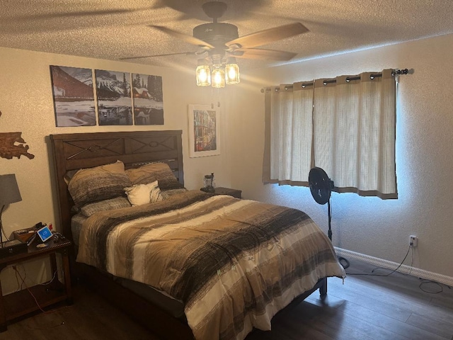 327 NE Surfside Ave, Port Saint Lucie, FL 34983 - bedroom featuring hardwood / wood-style floors, a textured ceiling, a textured wall, and ceiling fan
