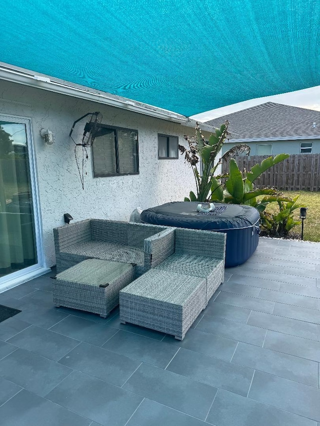 327 NE Surfside Ave, Port Saint Lucie, FL 34983 - view of patio / terrace featuring a hot tub