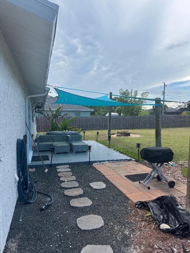 327 NE Surfside Ave, Port Saint Lucie, FL 34983 - fenced backyard featuring a patio
