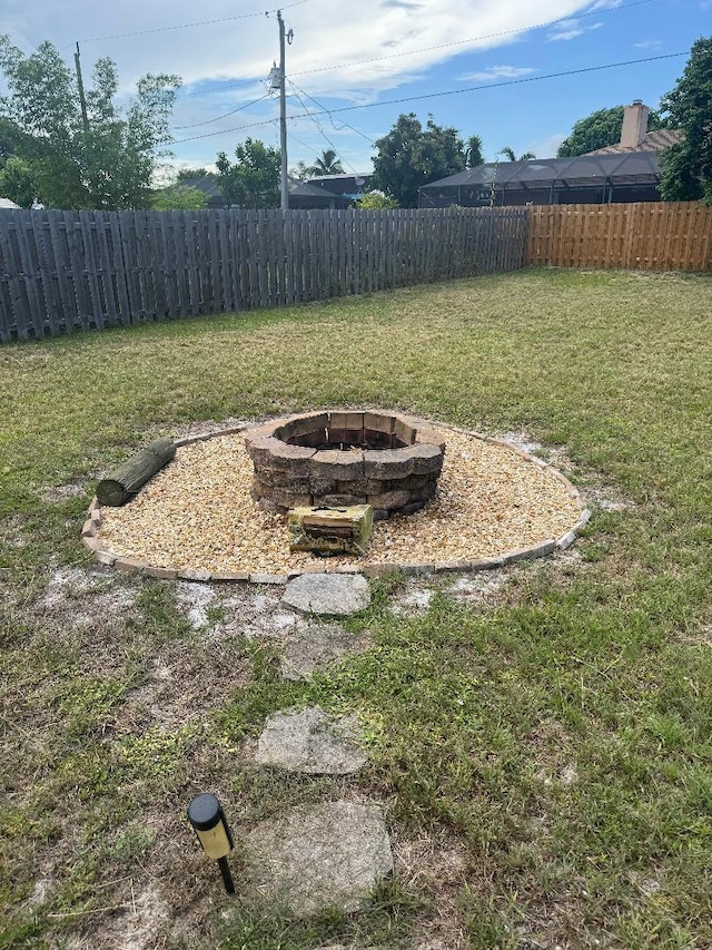 327 NE Surfside Ave, Port Saint Lucie, FL 34983 - view of yard with an outdoor fire pit