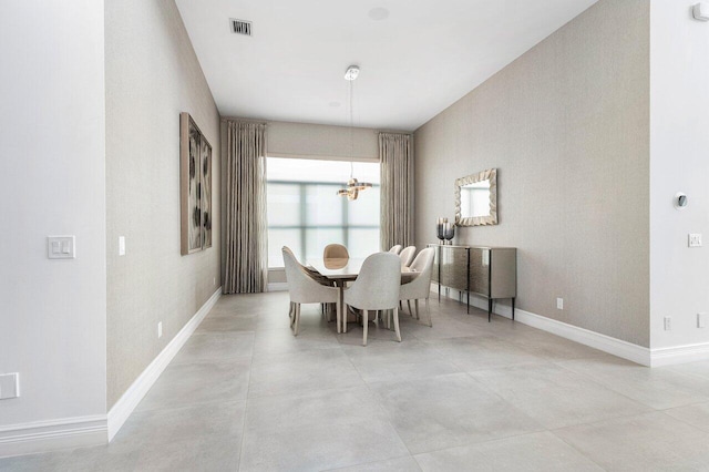 17432 Ponte Chiasso Dr, Boca Raton, FL 33496 - dining area featuring a chandelier and concrete floors
