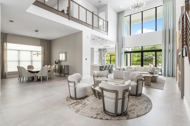 17432 Ponte Chiasso Dr, Boca Raton, FL 33496 - living area featuring a chandelier, a high ceiling, and tile patterned floors