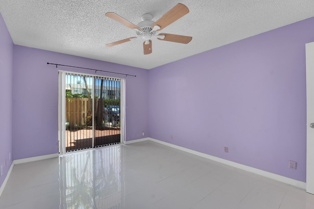612 Executive Center Dr Unit 106, West Palm Beach, FL 33401 - unfurnished room featuring a textured ceiling and ceiling fan
