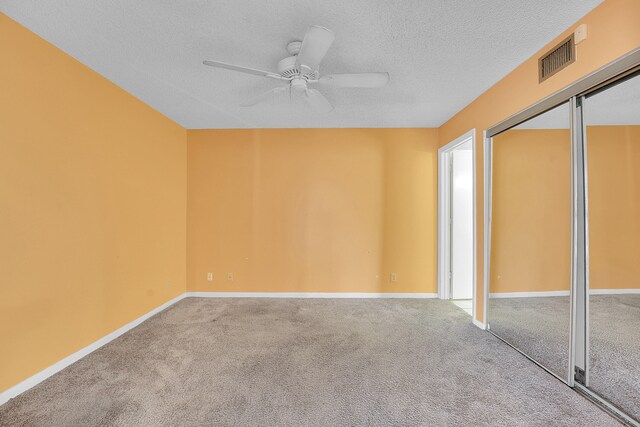 612 Executive Center Dr Unit 106, West Palm Beach, FL 33401 - carpeted empty room featuring ceiling fan and a textured ceiling