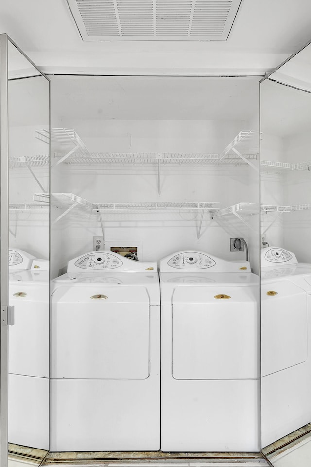 612 Executive Center Dr Unit 106, West Palm Beach, FL 33401 - laundry room featuring separate washer and dryer