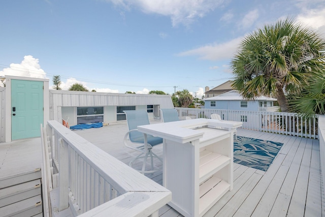 346 Hernando St, Hutchinson Island, FL 34949 - wooden deck with outdoor dining space
