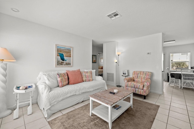 346 Hernando St, Hutchinson Island, FL 34949 - living room featuring light tile patterned flooring