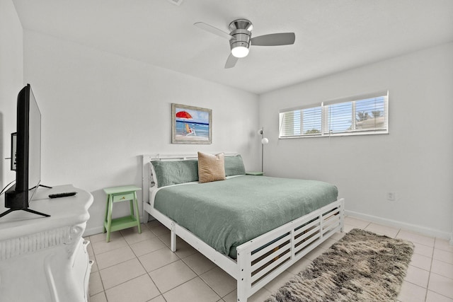346 Hernando St, Hutchinson Island, FL 34949 - bedroom with light tile patterned flooring and a ceiling fan