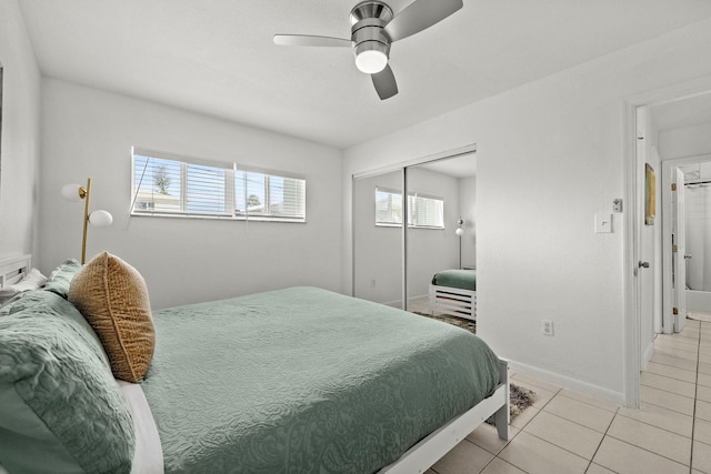 346 Hernando St, Hutchinson Island, FL 34949 - bedroom with light tile patterned floors, ceiling fan, and a closet