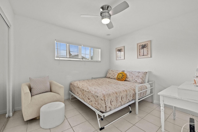 346 Hernando St, Hutchinson Island, FL 34949 - bedroom with a ceiling fan, a closet, and light tile patterned floors