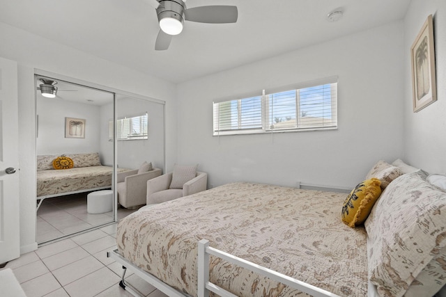 346 Hernando St, Hutchinson Island, FL 34949 - bedroom with tile patterned flooring, a closet, and a ceiling fan