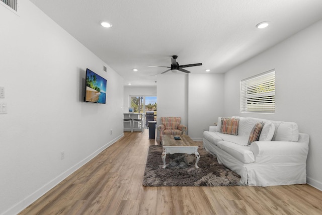 346 Hernando St, Hutchinson Island, FL 34949 - living area with wood finished floors, a ceiling fan, and recessed lighting