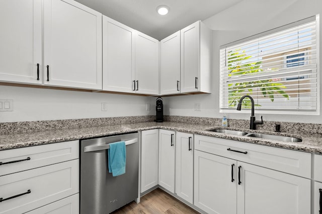 346 Hernando St, Hutchinson Island, FL 34949 - kitchen with stainless steel dishwasher, light wood-type flooring, white cabinetry, light stone counters, and recessed lighting