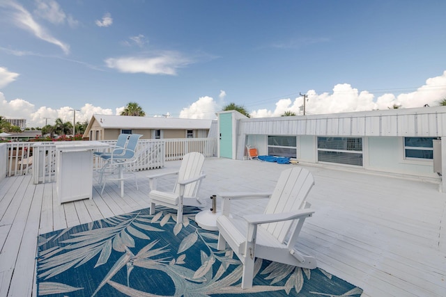346 Hernando St, Hutchinson Island, FL 34949 - wooden deck featuring outdoor dining space