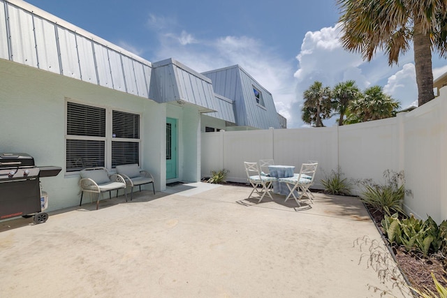 346 Hernando St, Hutchinson Island, FL 34949 - fenced backyard with grilling area and a patio