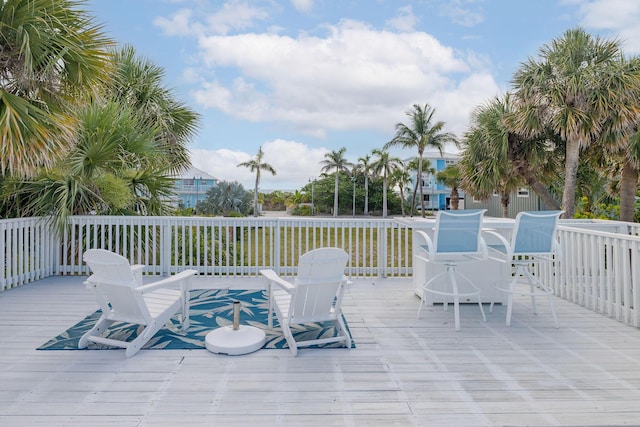 346 Hernando St, Hutchinson Island, FL 34949 - wooden terrace with outdoor dining space