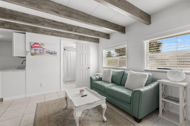 346 Hernando St, Hutchinson Island, FL 34949 - tiled living room with beamed ceiling and baseboards