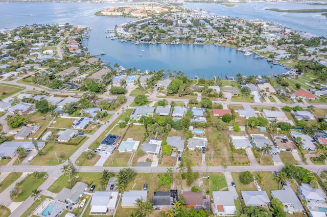 346 Hernando St, Hutchinson Island, FL 34949 - aerial overview of property's location with a large body of water and nearby suburban area