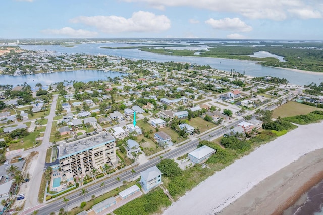 346 Hernando St, Hutchinson Island, FL 34949 - aerial view of property and surrounding area featuring a large body of water and nearby suburban area
