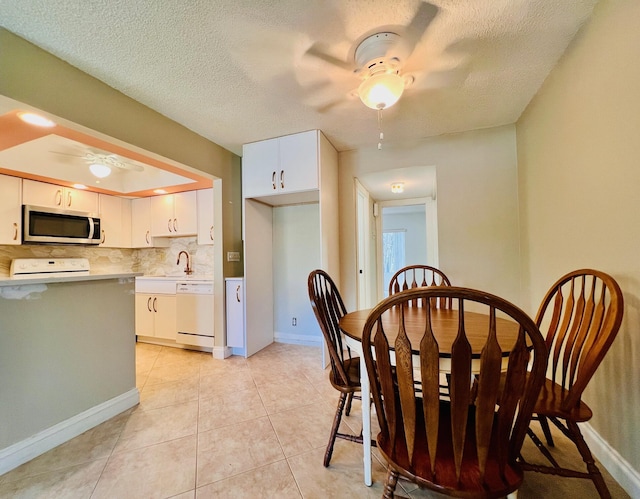 304 Sheffield M, West Palm Beach, FL 33417 - dining area featuring ceiling fan, light tile patterned flooring, and a textured ceiling