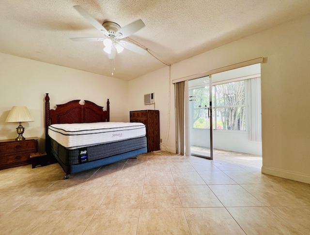 304 Sheffield M, West Palm Beach, FL 33417 - bedroom featuring access to exterior, tile patterned flooring, a textured ceiling, a wall mounted AC, and ceiling fan