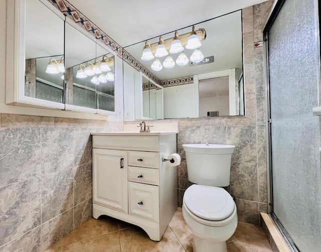 304 Sheffield M, West Palm Beach, FL 33417 - bathroom featuring tile walls, tile patterned floors, vanity, and a stall shower