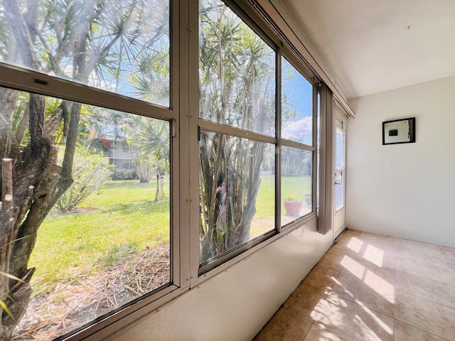 304 Sheffield M, West Palm Beach, FL 33417 - unfurnished sunroom featuring tile patterned flooring