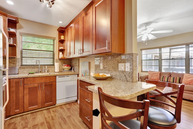 237 Farnham J, Deerfield Beach, FL 33442 - kitchen with dishwasher, open shelves, a ceiling fan, light wood finished floors, and recessed lighting