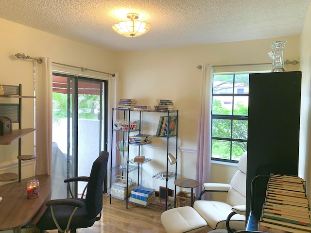101 Liberty Ct, Deerfield Beach, FL 33442 - home office featuring wood finished floors and a textured ceiling