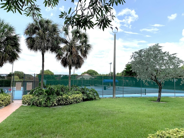 101 Liberty Ct, Deerfield Beach, FL 33442 - view of tennis court featuring a gate