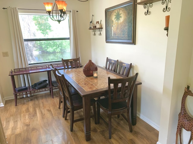 101 Liberty Ct, Deerfield Beach, FL 33442 - dining area with wood finished floors and a chandelier