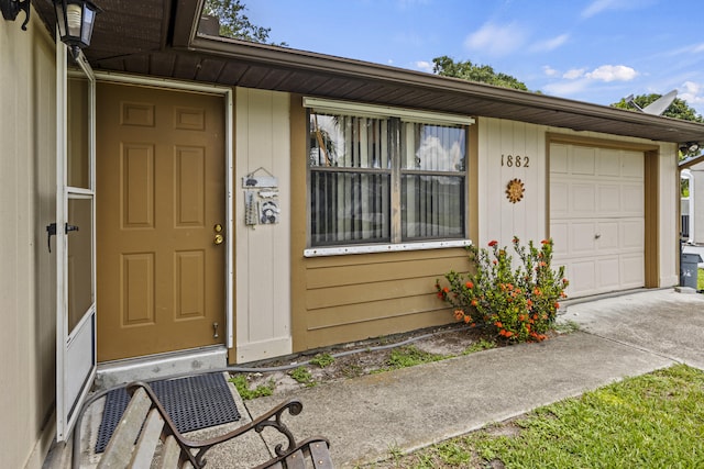 1882 SW Agnes St, Port Saint Lucie, FL 34953 - view of exterior entry with concrete driveway