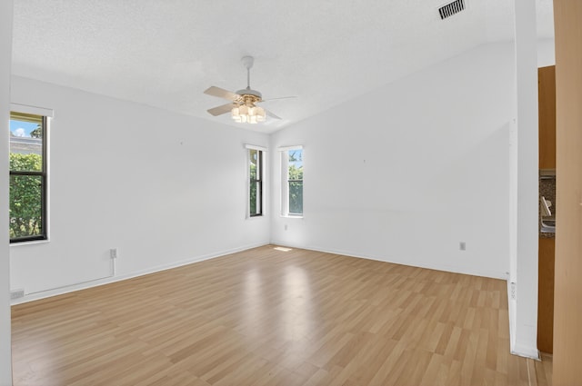 2915 NW 14th St, Delray Beach, FL 33445 - empty room featuring light wood-type flooring, ceiling fan, and vaulted ceiling
