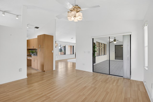 2915 NW 14th St, Delray Beach, FL 33445 - empty room featuring a ceiling fan, lofted ceiling, track lighting, and light wood-style flooring