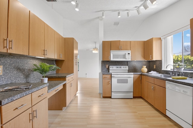 2915 NW 14th St, Delray Beach, FL 33445 - kitchen with white appliances, light wood-style floors, high vaulted ceiling, tasteful backsplash, and a ceiling fan