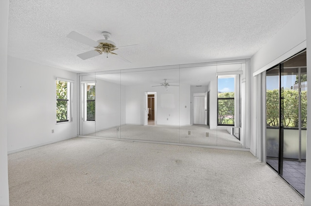 2915 NW 14th St, Delray Beach, FL 33445 - spare room featuring a ceiling fan, a textured ceiling, and carpet