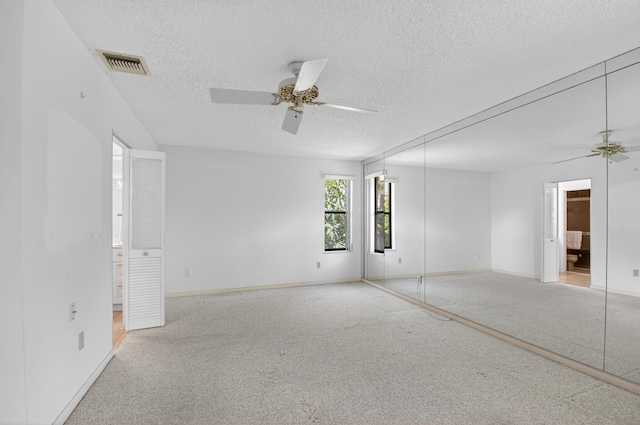 2915 NW 14th St, Delray Beach, FL 33445 - empty room featuring a ceiling fan, a textured ceiling, and carpet